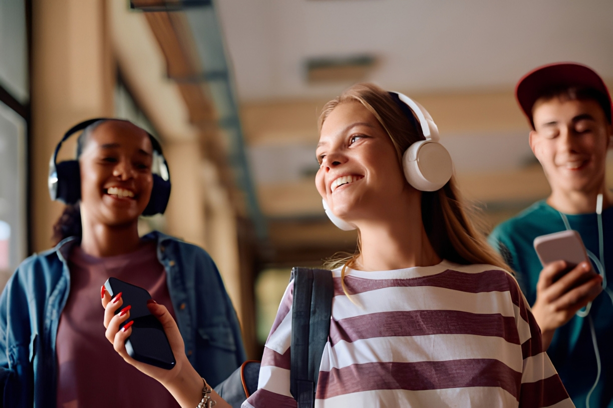 Student listening to academic PDF audiobooks on headphones