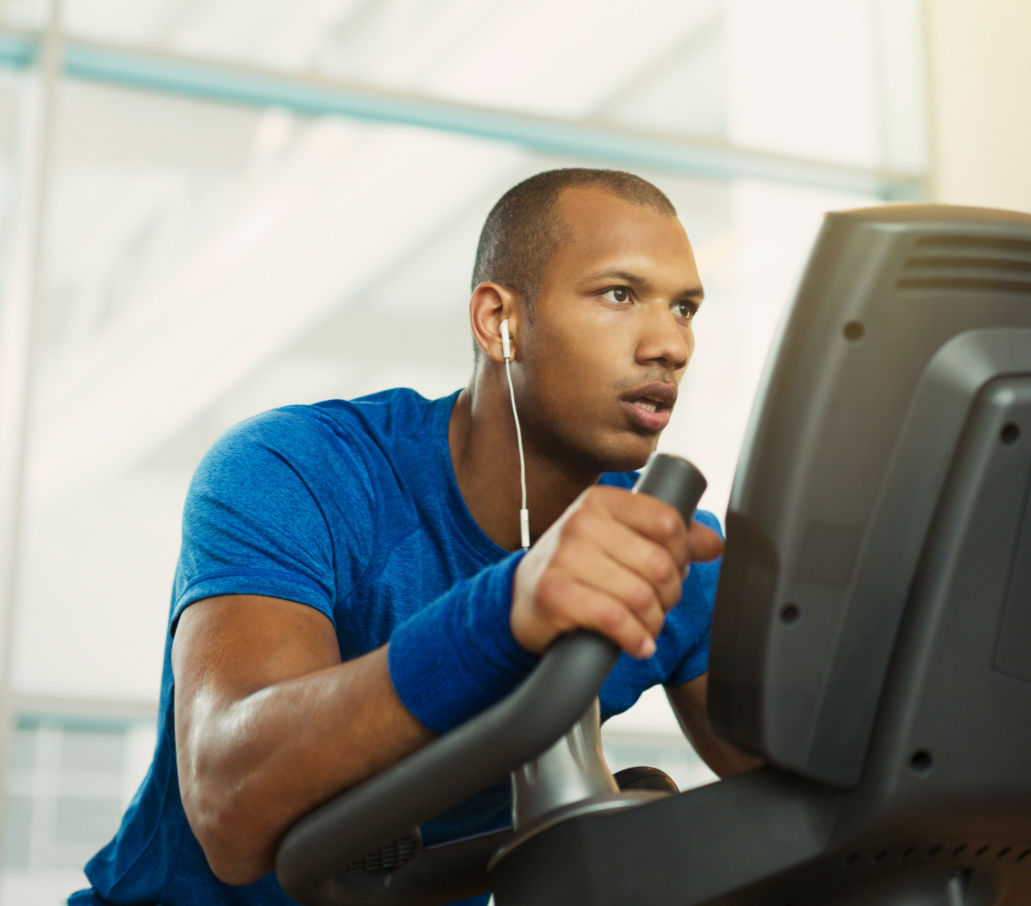 Student listening to audio lectures while working out